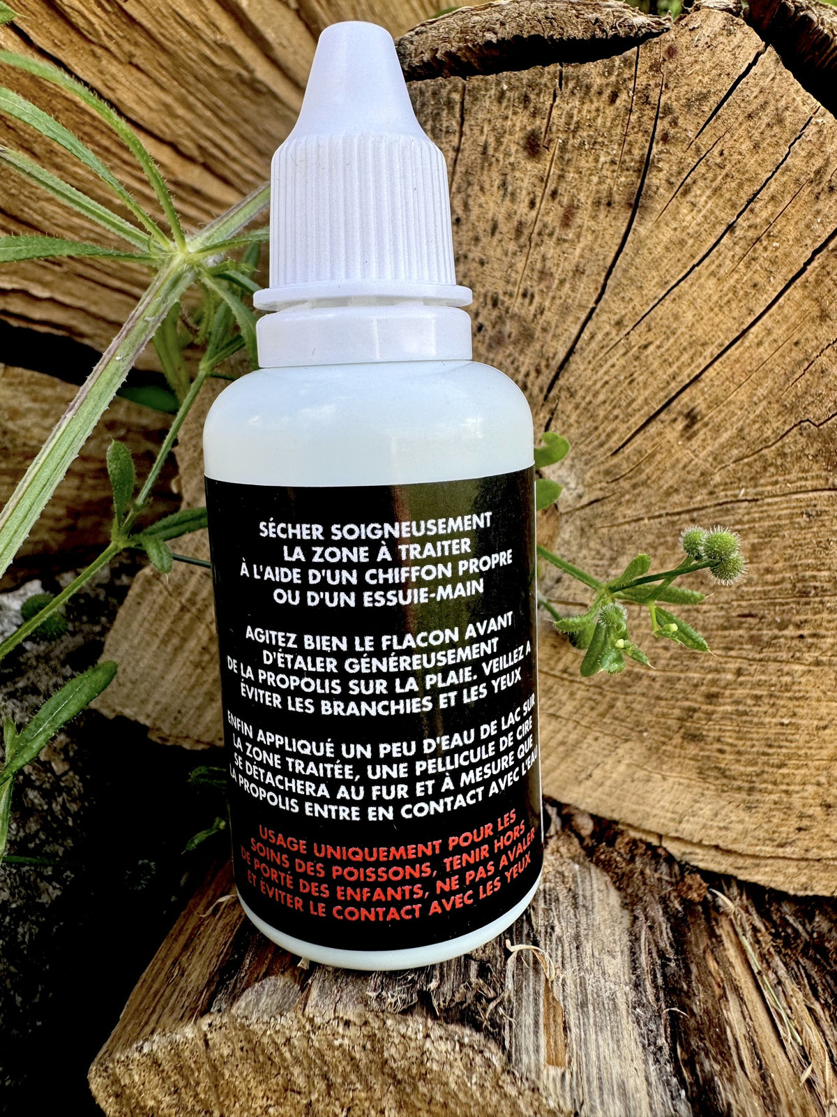 Flacon Heal Fish 30 ml, étiquette noire avec texte français, bouchon blanc.